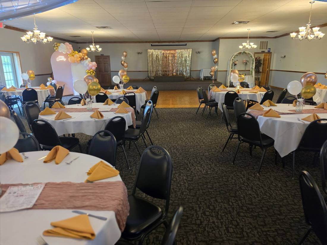 Houston Hall from the back of the room — dance floor, arches and round tables set for a party